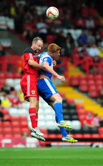 Framed Print : Louis Carey vs Matt Harold: Intense Rivalry in the Bristol Derby Pre-Season Friendly at Ashton Gate Stadium, 2012