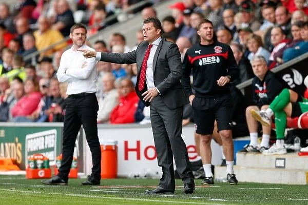 Manager Clash: Steve Cotterill of Bristol City and Graham Alexander of Fleetwood Lock Horns during Sky Bet League 1 Match