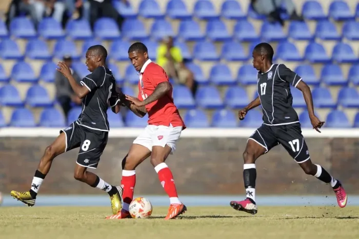 Framed Print : Mark Little Faces Off Against Mosimanegape Ntwanetsi in Extension Gunners vs. Bristol City Clash