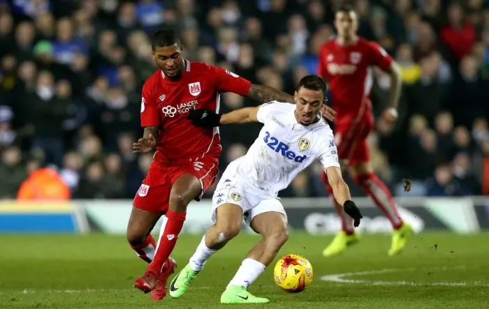 Framed Print : Mark Little vs Kemar Roofe: Intense Moment at Elland Road during Leeds United vs Bristol City Championship Clash