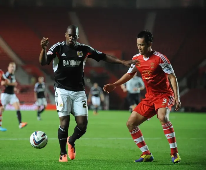 Framed Print : Marlon Harewood vs Maya Yoshida: A Battle at St. Mary's Stadium, Southampton vs Bristol City, 2013