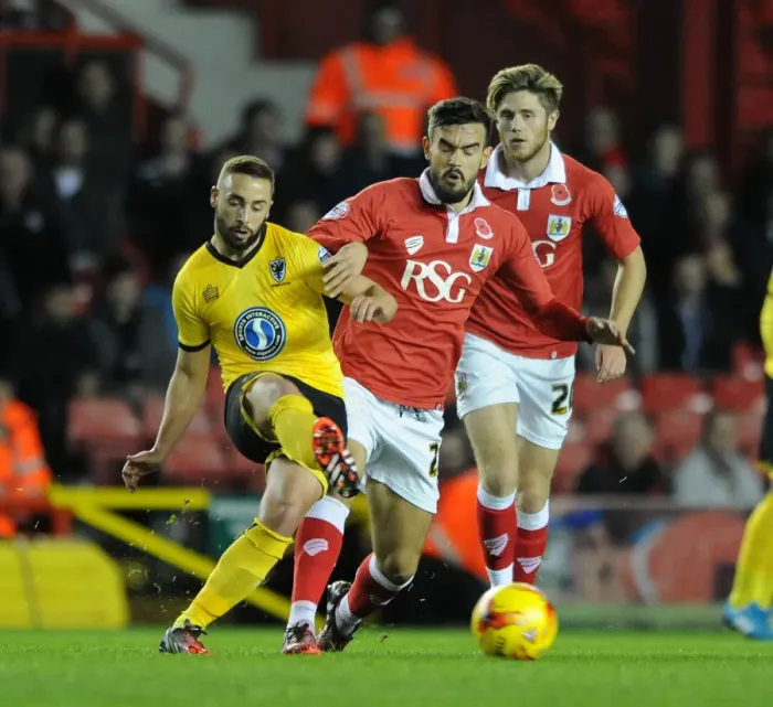 Framed Print : Marlon Pack of Bristol City Closes In on Sammy Moore of AFC Wimbledon during Johnstone's Paint Trophy Match
