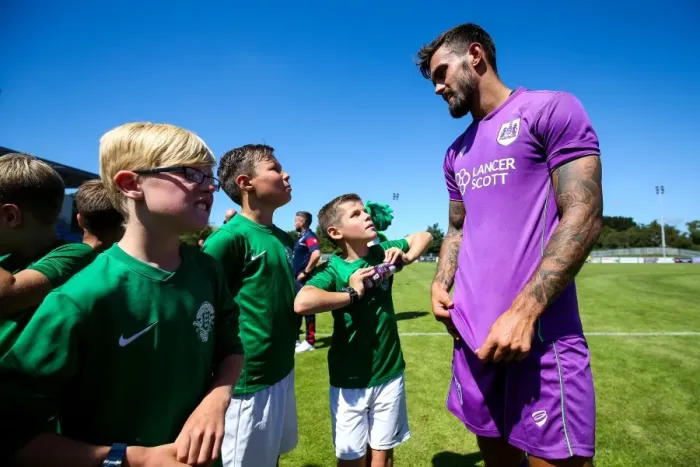 Framed Print : Marlon Pack of Bristol City Meets Young Mascots during Guernsey FC vs. Bristol City Pre-season Friendly