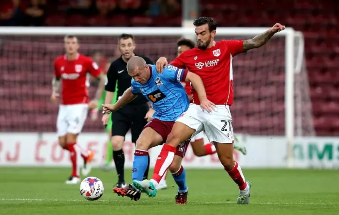 Framed Print : Marlon Pack Tackles Stephen Dawson: Intense Moment from Scunthorpe United vs. Bristol City EFL Cup Clash Framed Print : Marlon Pack Tackles Stephen Dawson: Intense Moment from Scunthorpe United vs. Bristol City EFL Cup Clash
