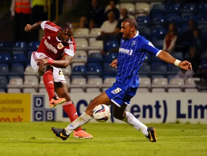Framed Print : Maron Harewood's Shot Blocked by Leon Legge in Gillingham vs. Bristol City Football Match, 2013