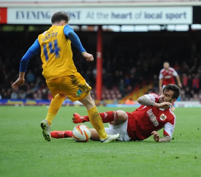 Framed Print : Maron Pack Tackles Joe Garner in Intense Bristol City vs Preston North End Football Match, Sky Bet League One, Ashton Gate