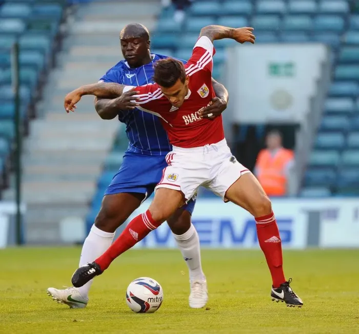 Framed Print : Maron Pack vs. Adebayo Akinfenwa: Battle in the First Round of the Capital One Cup at Priestfield Stadium (Gillingham V Bristol City) Framed Print : Maron Pack vs. Adebayo Akinfenwa: Battle in the First Round of the Capital One Cup at Priestfield Stadium (Gillingham V Bristol City)