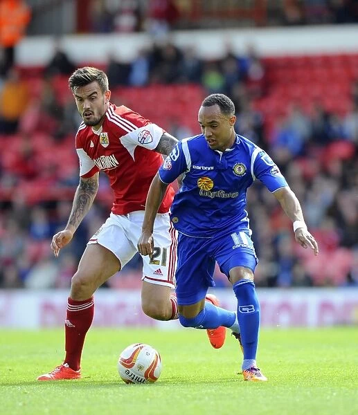 Maron Pack vs Bryon Moore: Intense Battle for Possession in Bristol City vs Crewe Football Match, April 2014