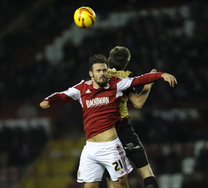 Framed Print : Maron Pack vs. David Mooney: Intense Battle for the Ball at Ashton Gate, Bristol City vs. Leyton Orient (November 2013)