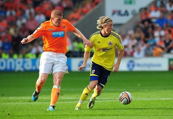 Martyn Woolford Advances Ball in League Cup Match: Bristol City vs. Blackpool (1st October 2011)