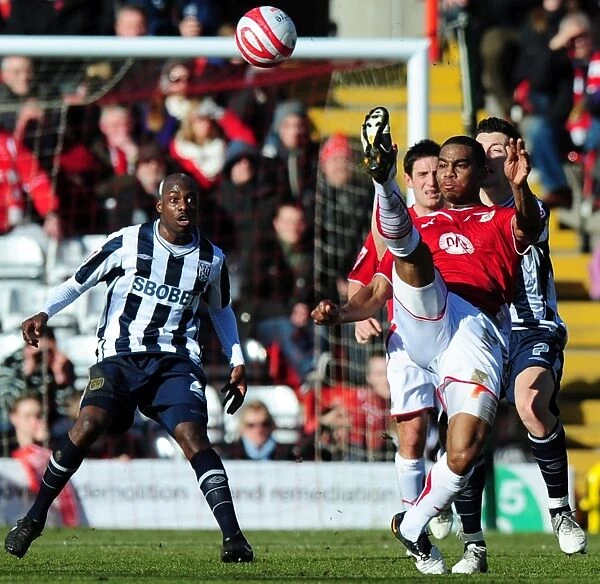 Marvin Elliott Clears Ball from Robert Koren: A Pivotal Moment in the 2010 Football Championship Clash between Bristol City and West Bromwich Albion