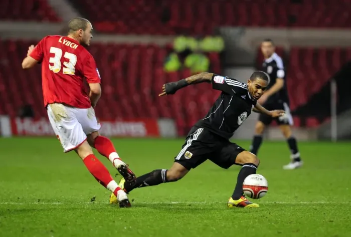 Framed Print : Marvin Elliott Tackles Joel Lynch: Intense Moment in Nottingham Forest vs. Bristol City Football Match, Npower Championship, 2011