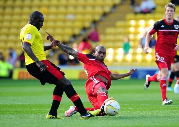 Marvin Elliott Tackles Nyron Nosworthy: Intense Moment in the Championship Clash between Watford and Bristol City