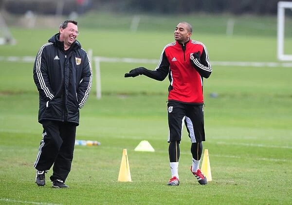 Marvin Elliott and the Team Doctor: A Light-Hearted Moment at Bristol City Football Club Training (January 12, 2012)
