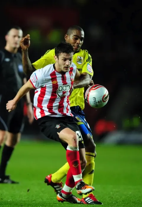 Framed Print : Marvin Elliott vs. Adam Lallana: Battle for the Ball in Southampton v Bristol City Championship Clash (December 2011) Framed Print : Marvin Elliott vs. Adam Lallana: Battle for the Ball in Southampton v Bristol City Championship Clash (December 2011)