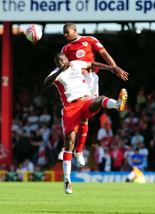 Framed Print : Marvin Elliott vs. Guy Moussi: Aerial Clash in the Championship Showdown between Bristol City and Nottingham Forest, April 2011 Framed Print : Marvin Elliott vs. Guy Moussi: Aerial Clash in the Championship Showdown between Bristol City and Nottingham Forest, April 2011