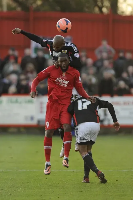 Framed Print : Marvin Elliott vs. Justin Richards: Aerial Battle in FA Cup Match between Tamworth and Bristol City