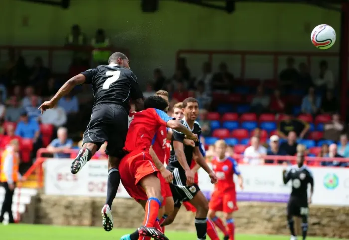 Framed Print : Marvin Elliott's Determined Charge Towards Aldershot's Goal Framed Print : Marvin Elliott's Determined Charge Towards Aldershot's Goal