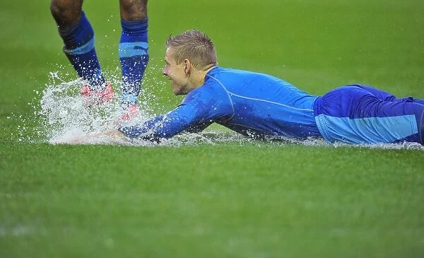 Matej Vydra Slides on Flooded Pitch: Bristol City vs. Watford Match Postponed