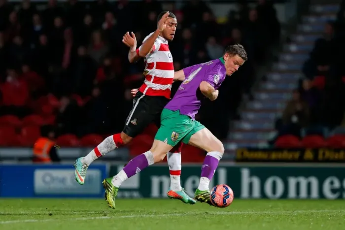 Framed Print : Matt Smith vs Reece Wabara: Intense Clash in Doncaster Rovers vs Bristol City FA Cup Match, January 2015 Framed Print : Matt Smith vs Reece Wabara: Intense Clash in Doncaster Rovers vs Bristol City FA Cup Match, January 2015