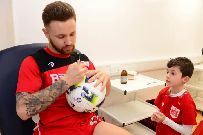 Framed Print : Matty Taylor Greets Mascot with Autographs Before Bristol City vs. Fulham Framed Print : Matty Taylor Greets Mascot with Autographs Before Bristol City vs. Fulham