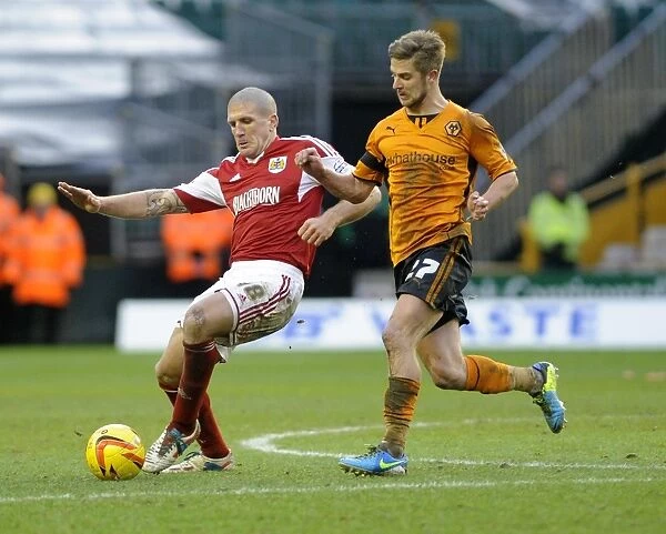Michael Jacobs vs Adam El-Abd: Intense Battle for the Ball in Wolverhampton Wanderers vs Bristol City (25 / 01 / 2014)