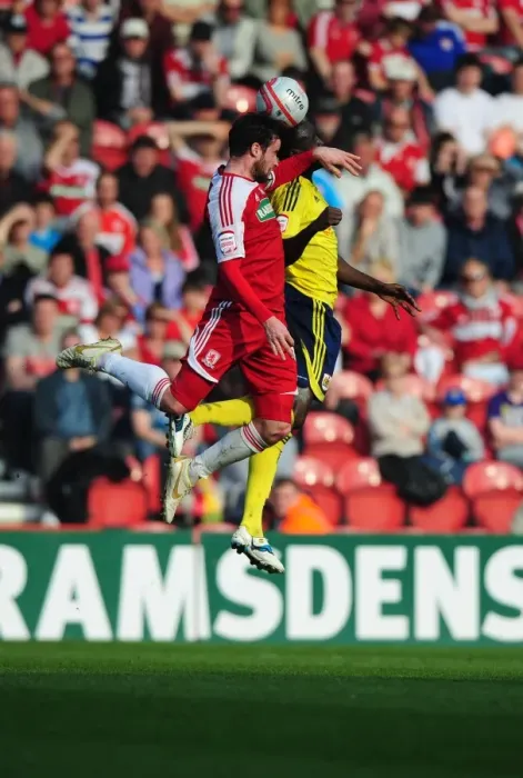 Framed Print : Middlesbrough's Matthew Bates vs. Albert Adomah of Bristol City - A Battle for the High Ball at Riverside Stadium, 2012 Framed Print : Middlesbrough's Matthew Bates vs. Albert Adomah of Bristol City - A Battle for the High Ball at Riverside Stadium, 2012