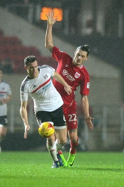 Milan Djuric of Bristol City Clashes with Kevin McDonald of Fulham in Sky Bet Championship Match