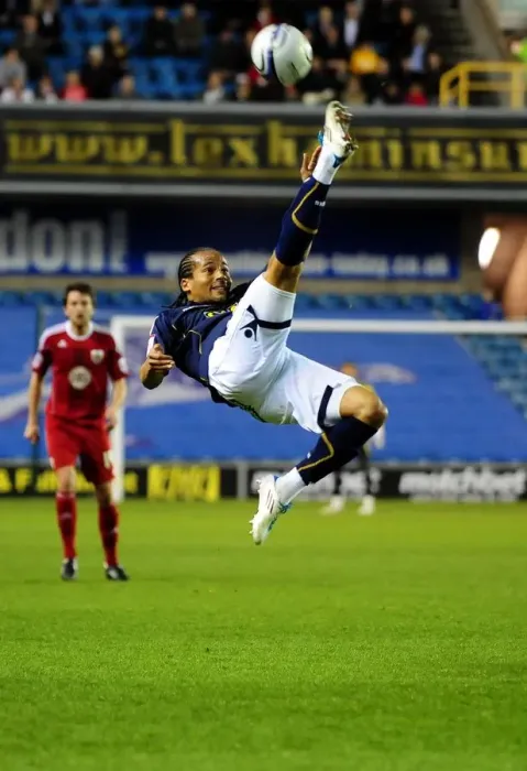 Framed Print : Mkandawire Clears the Ball: Millwall vs. Bristol City, Championship Match, The Den, 12th April 2011