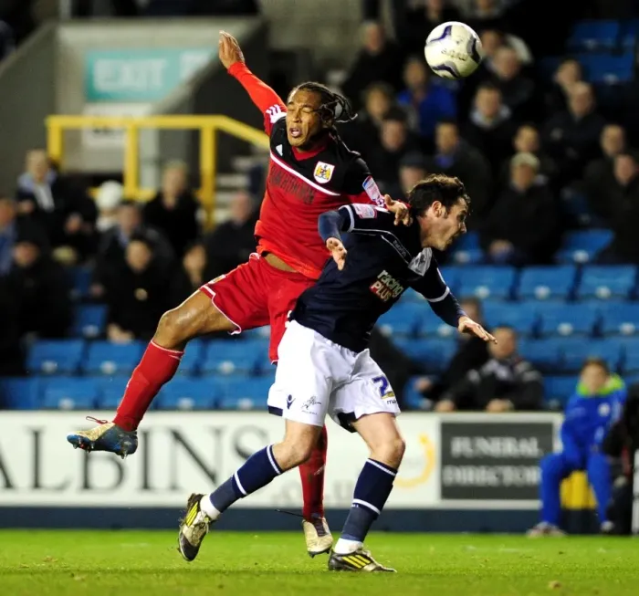 Framed Print : Neil Danns vs. Alan Dunne: Aerial Battle in Millwall vs. Bristol City Championship Clash Framed Print : Neil Danns vs. Alan Dunne: Aerial Battle in Millwall vs. Bristol City Championship Clash