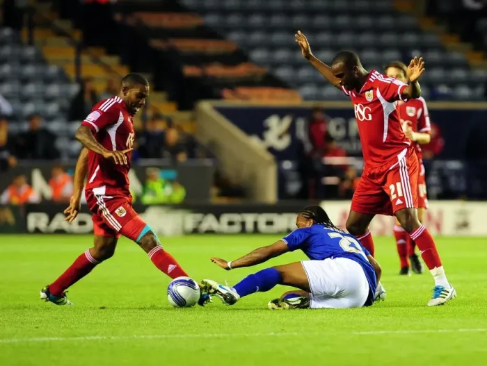 Framed Print : Neil Danns vs. Marvin Elliott and Kalifa Cisse: Intense Battle in Leicester City vs. Bristol City Championship Match, August 2011