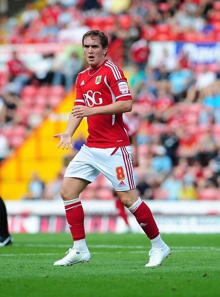 Neil Kilkenny Faces Off Against West Brom in Intense Championship Clash at Ashton Gate, 2011