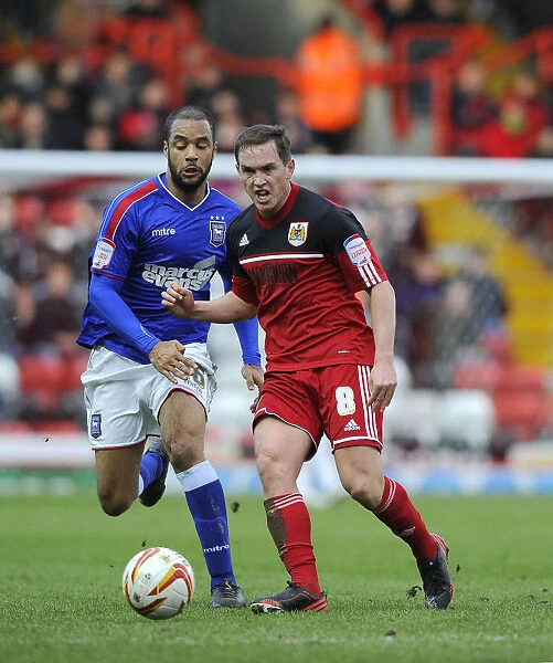 Neil Kilkenny vs. David McGoldrick: Intense Battle for the Ball in the Npower Championship Match between Bristol City and Ipswich Town (January 2013)