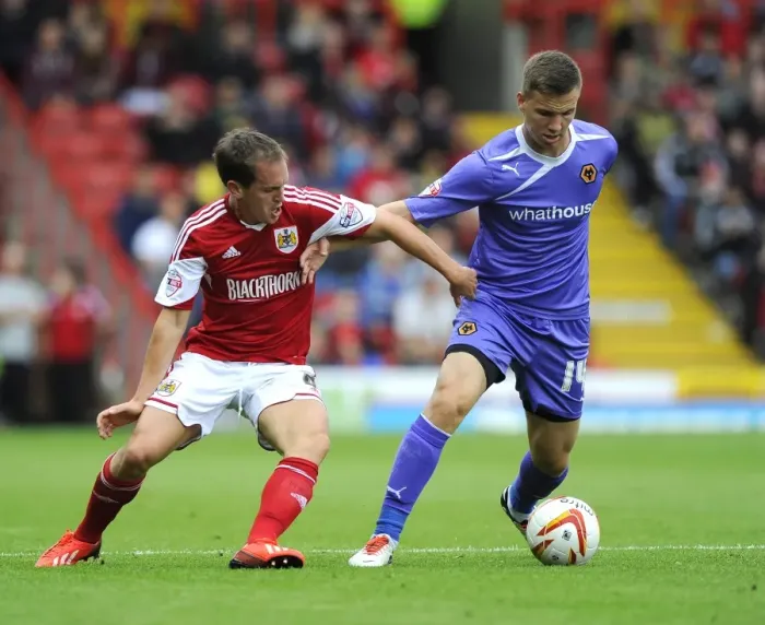 Framed Print : Neil Kilkenny vs. Lee Evans: Intense Battle for Ball Possession in Bristol City vs. Wolves