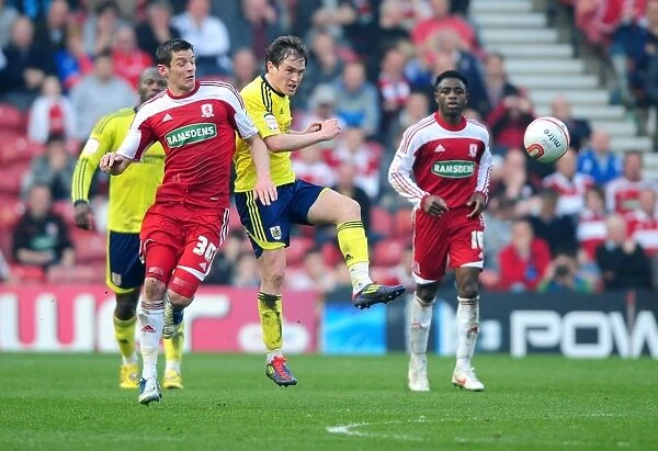 Neil Kilkenny vs. Lukas Jutkiewicz: Battle for the Ball in Middlesbrough vs. Bristol City Football Match, March 2012