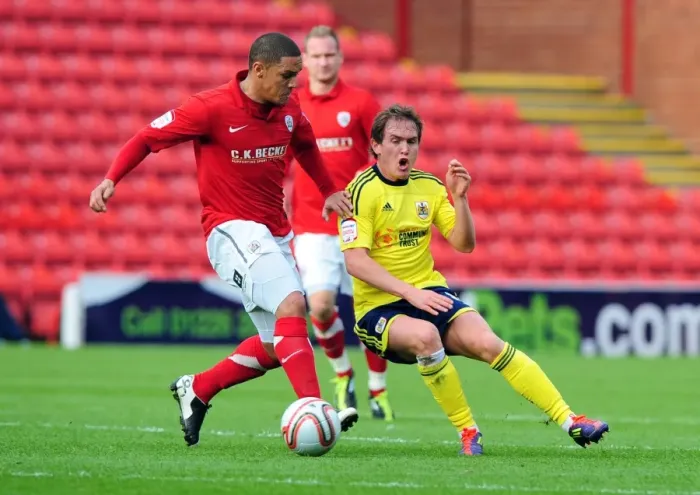 Framed Print : Neil Kilkenny vs. Nathan Doyle: Intense Battle for the Ball in the 2011 Championship Match between Barnsley and Bristol City Framed Print : Neil Kilkenny vs. Nathan Doyle: Intense Battle for the Ball in the 2011 Championship Match between Barnsley and Bristol City