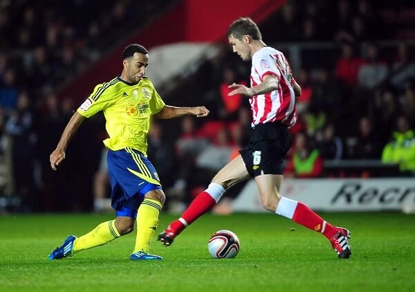 Nicky Maynard Outmaneuvers Jos Hooiveld in Championship Clash: Southampton vs. Bristol City (30 / 12 / 2011)