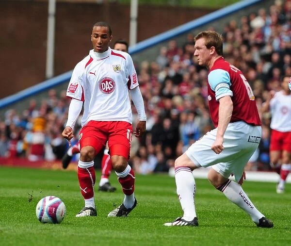 Nicky Maynard and Steven Caldwell: A Moment from the Burnley vs. Bristol City Football Match
