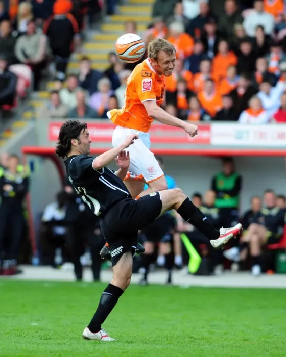 Framed Print : Ormerod vs Hartley: Aerial Battle in the Championship Clash between Blackpool and Bristol City - 02 / 05 / 2010