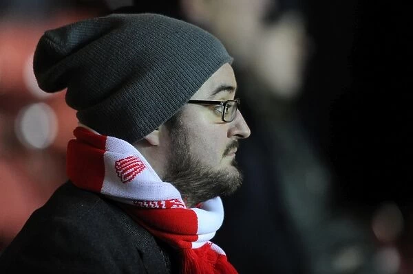 Passionate Bristol City Fan Cheers at Ashton Gate Stadium during FA Cup Third Round Replay