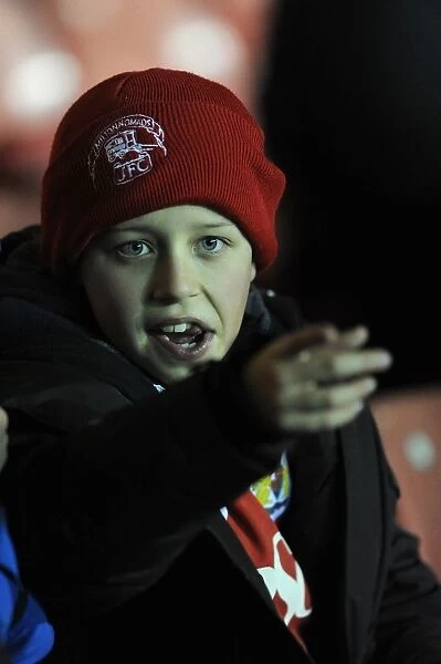 Passionate Bristol City Fan Cheers at Ashton Gate Stadium during FA Cup Third Round Replay
