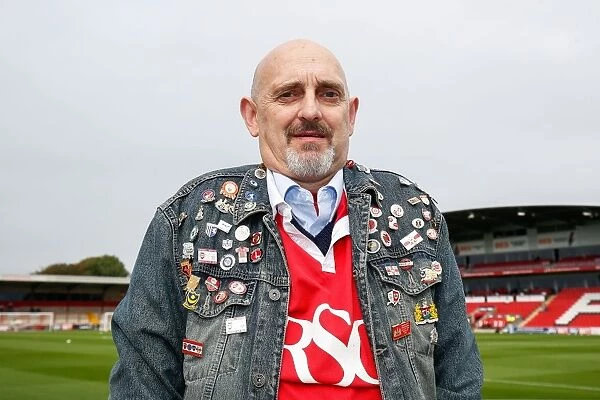 A Passionate Bristol City Fan Displays His Pin Badge Collection at Fleetwood Town Match