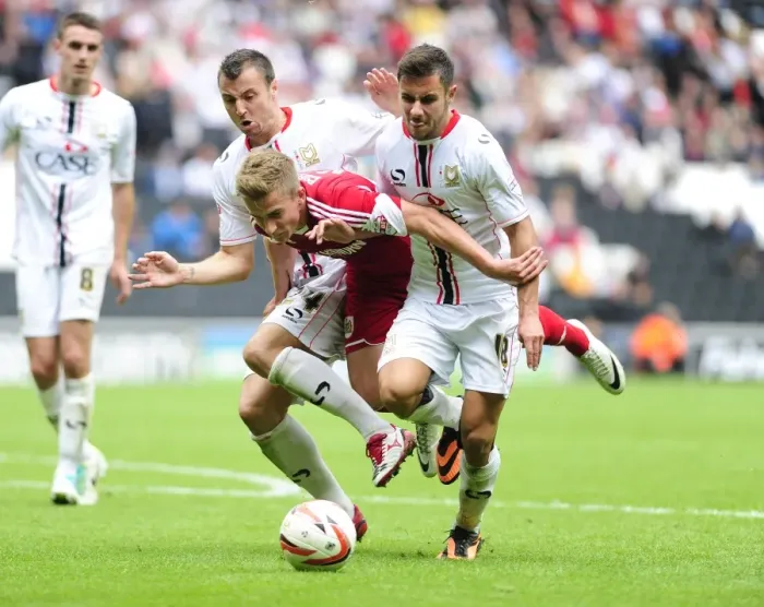 Framed Print : Penalty Controversy: Joe Bryan vs. Milton Keynes Dons Antony Kay and George Baldock