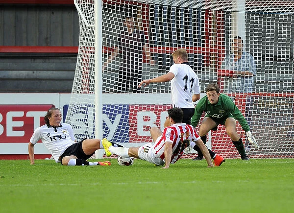 Penalty Drama: Terry Gornell Fouled by Luke Ayling in Cheltenham Town vs. Bristol City Match