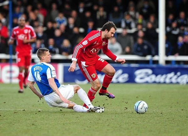 Peterborough's Ryan Bennett Stops Brett Pitman's Advance: Peterborough United vs. Bristol City Football Rivalry
