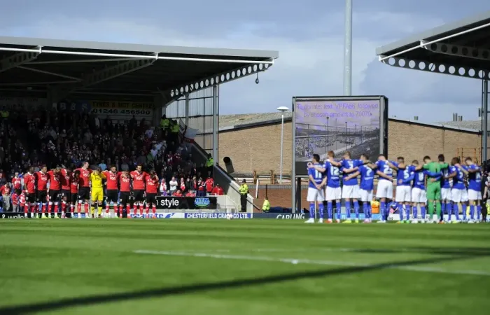 Framed Print : Respectful Moment: Chesterfield vs. Bristol City Footballers Honor a Minute's Silence