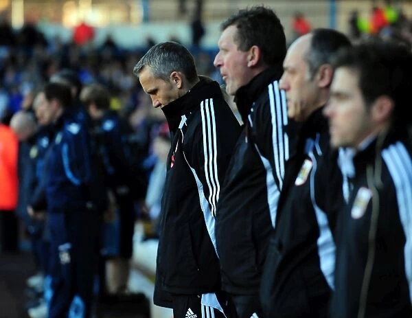 Respectful Moment: Keith Milen and Bristol City Coaching Staff Honor Minutes Silence at Elland Road during Leeds United vs. Bristol City Championship Match (November 13, 2010)