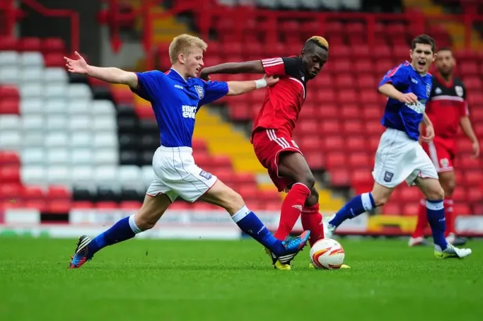 Framed Print : Ridwan Oluwatobi's Determined Battle for Possession: Bristol City U21s vs Ipswich Town U21s