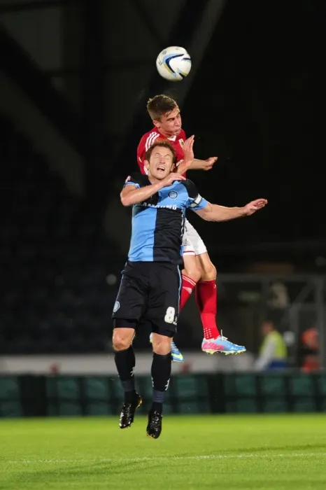 Framed Print : Rivalry Reignites: Bristol City vs Wycombe Wanderers in Johnstone's Paint Trophy Clash at Adams Park (October 8, 2013)