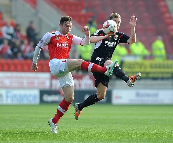 Rotherham United's Lee Frecklington Clears Ball from Wade Elliott in Sky Bet League One Clash